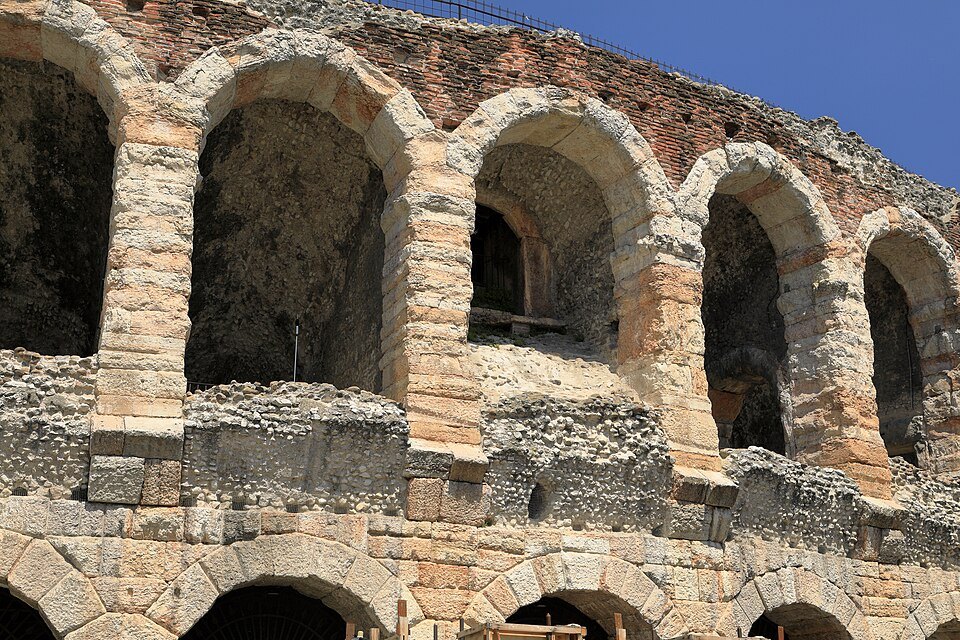 The double tier of arches up close, rough stone over brick