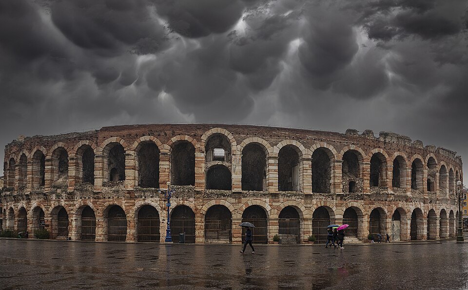 Storm clouds over the Arena and the wet paving of Piazza Bra