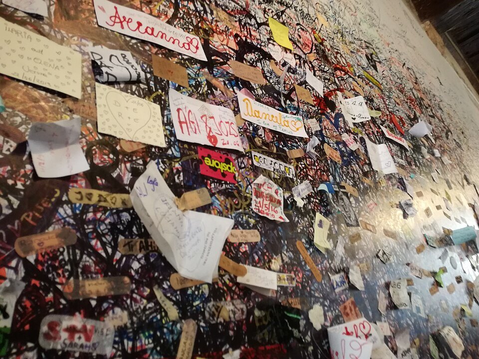 Notes and messages stuck over the courtyard walls