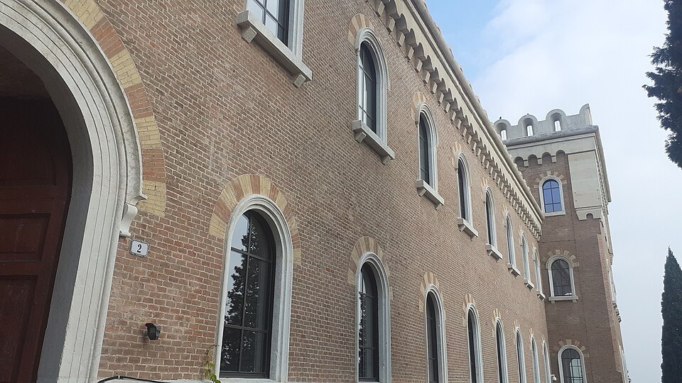The barracks' long brick front and arched door