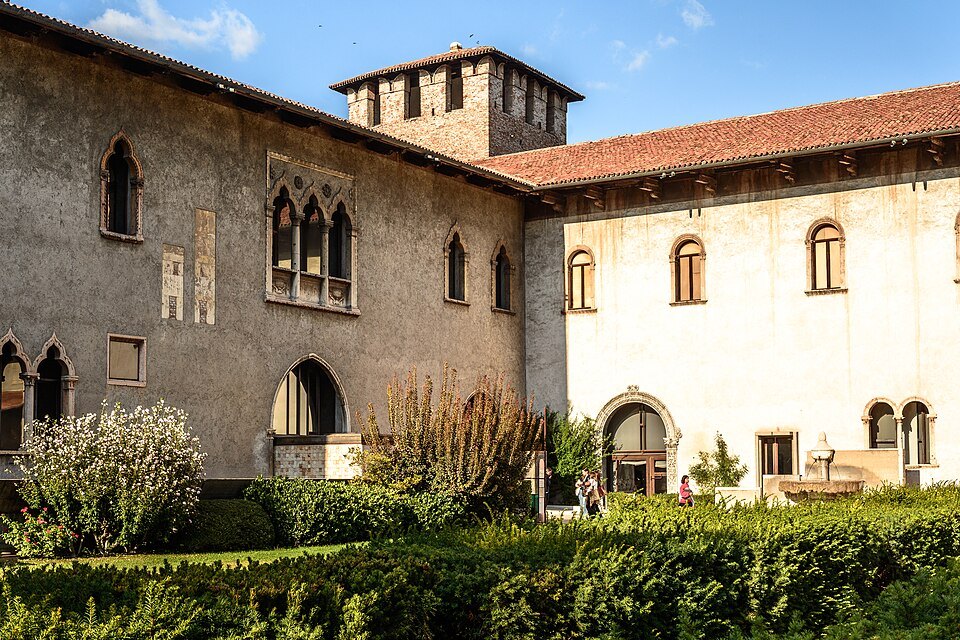 The museum wing's windows over the courtyard garden