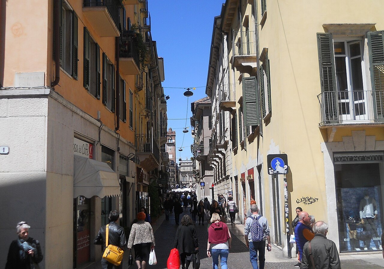Walkers in Via Cappello in the old center