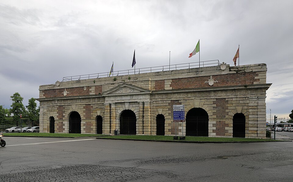 The Porta Nuova gate from the ring road, flags on its roof