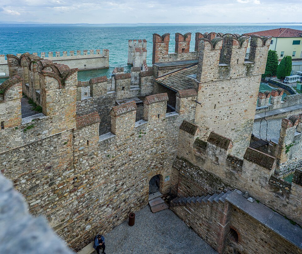 The battlemented towers of Sirmione's castle above the lake