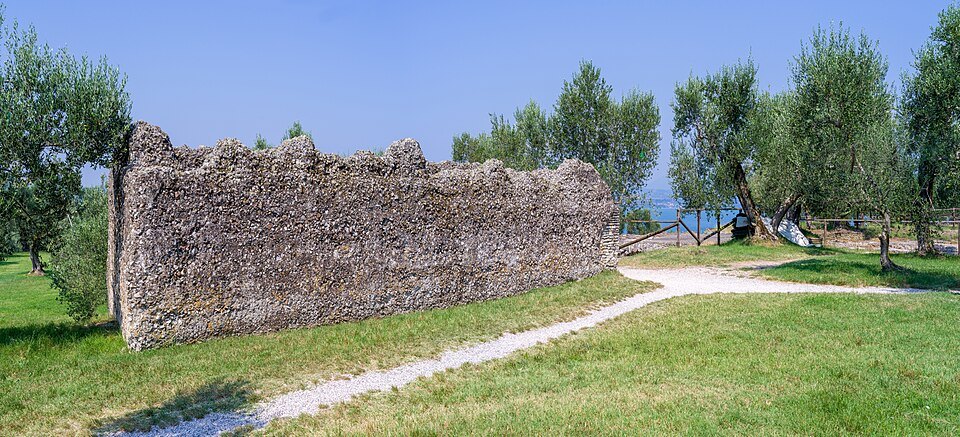 Old Roman walls among olive trees at the Grotte di Catullo, Sirmione