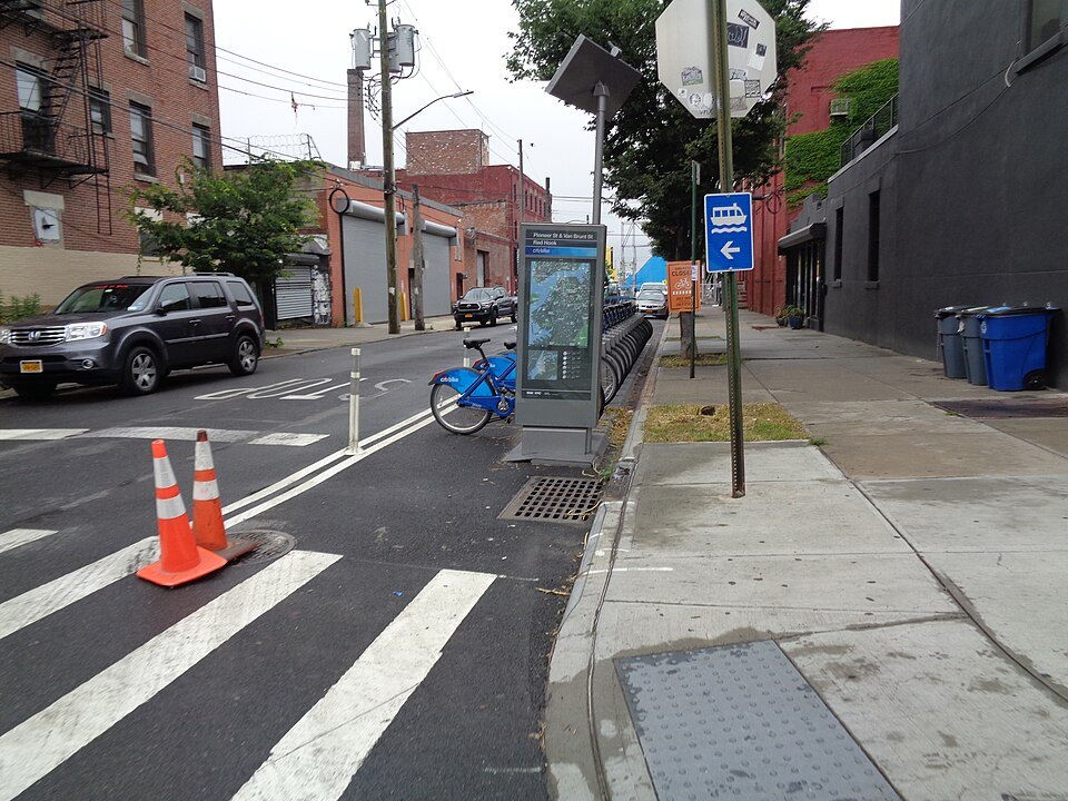 A shared-bike station on a Verona street corner