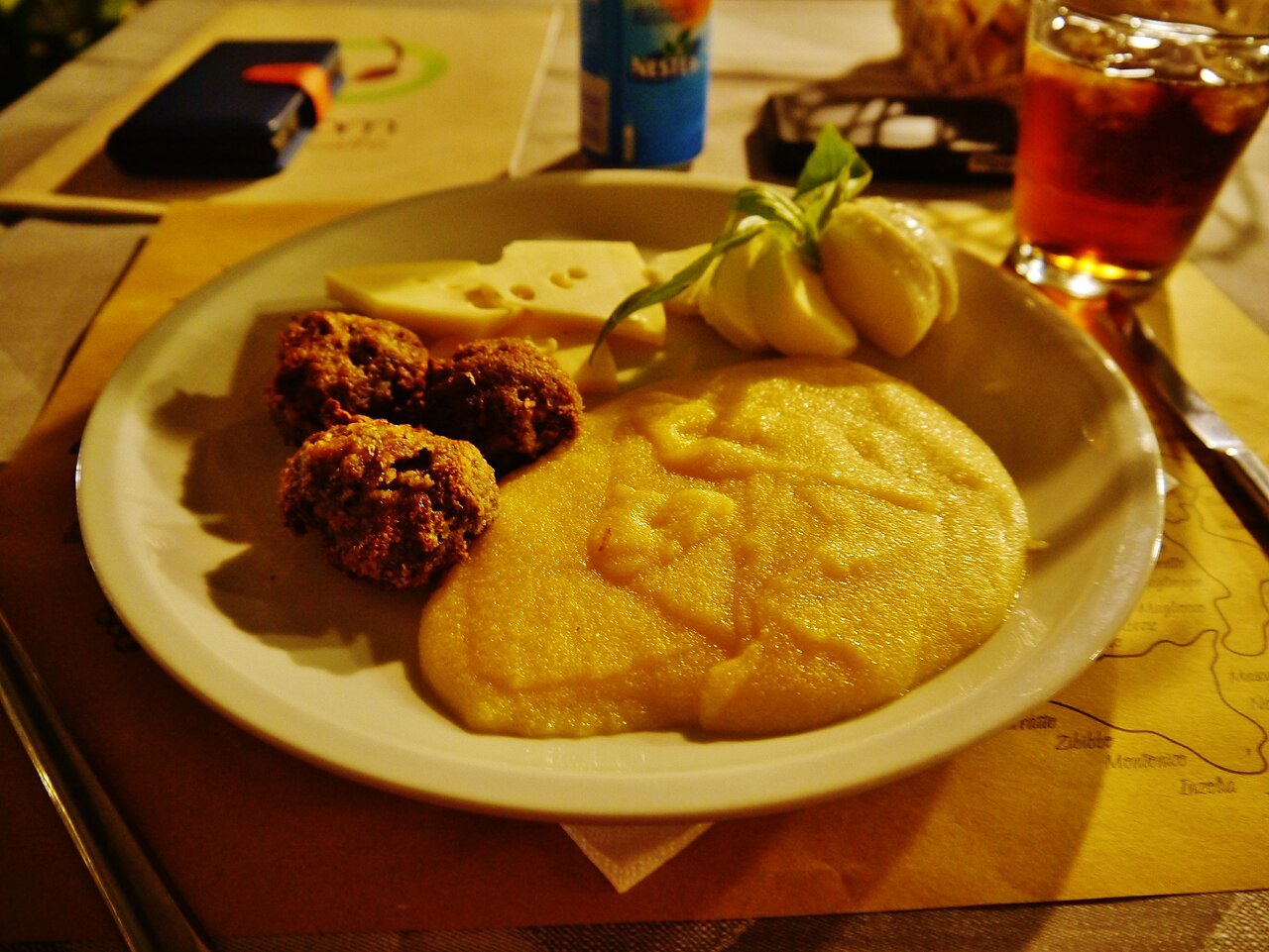 A Verona dinner plate of polenta, meatballs and cheese