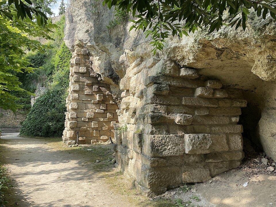 Old stonework built into the rock of the upper garden