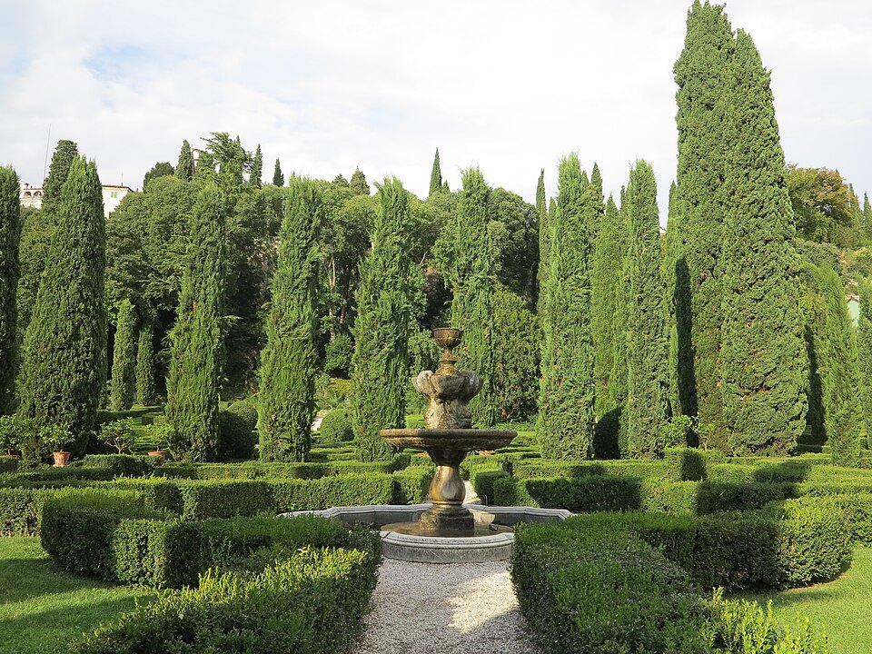 Parterres, a fountain and tall cypresses in the Italian garden