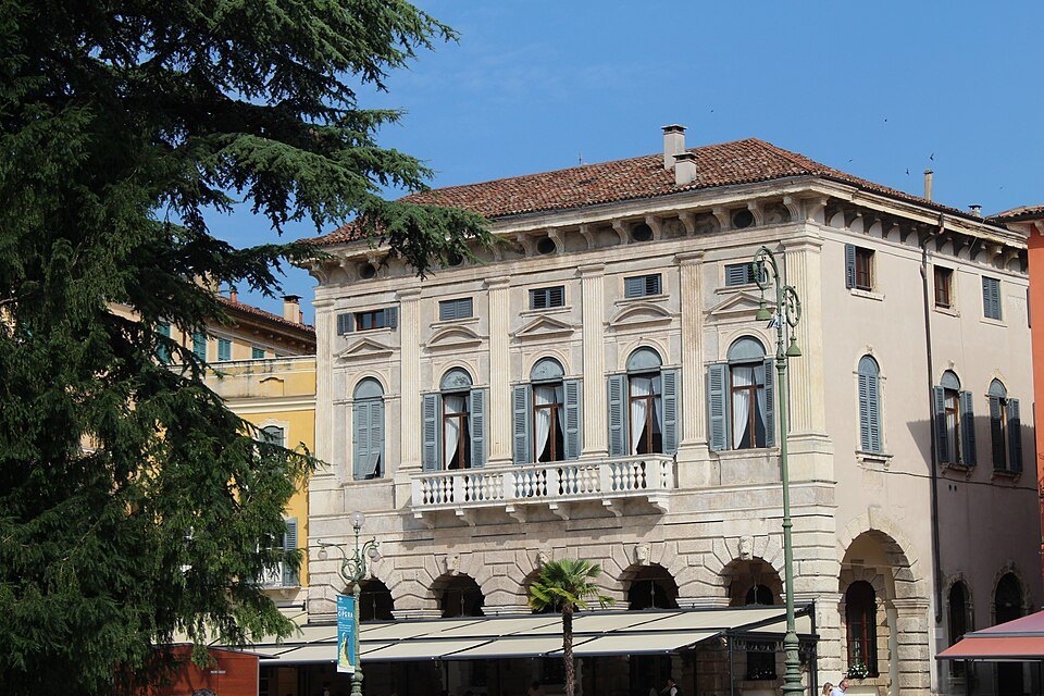 A palazzo on the Liston behind the trees of Piazza Bra