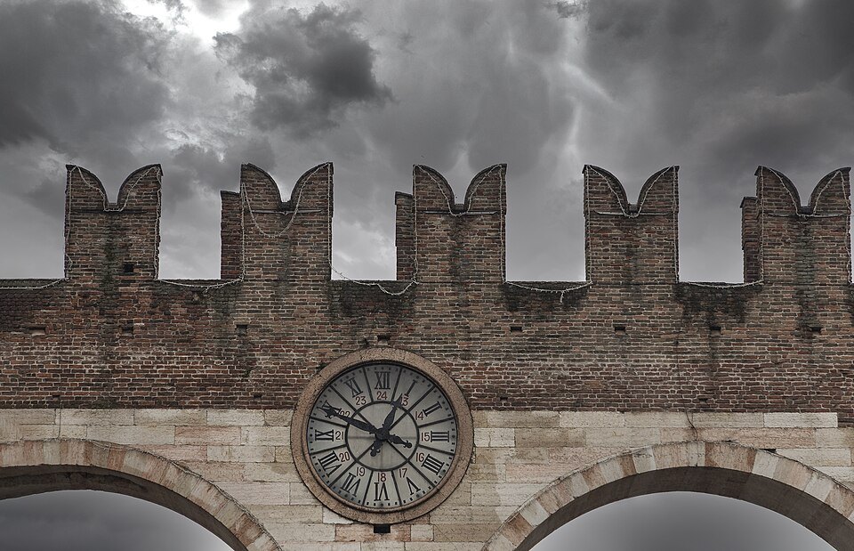 The clock on the battlemented Portoni della Bra