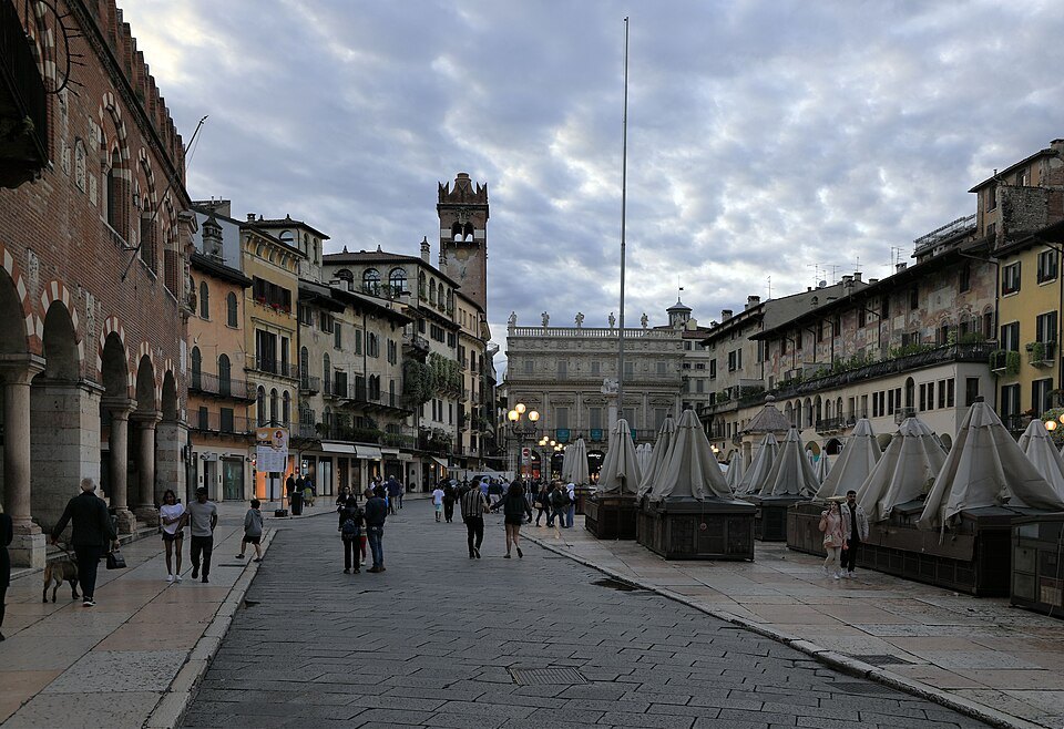 The market street of Piazza delle Erbe towards Palazzo Maffei