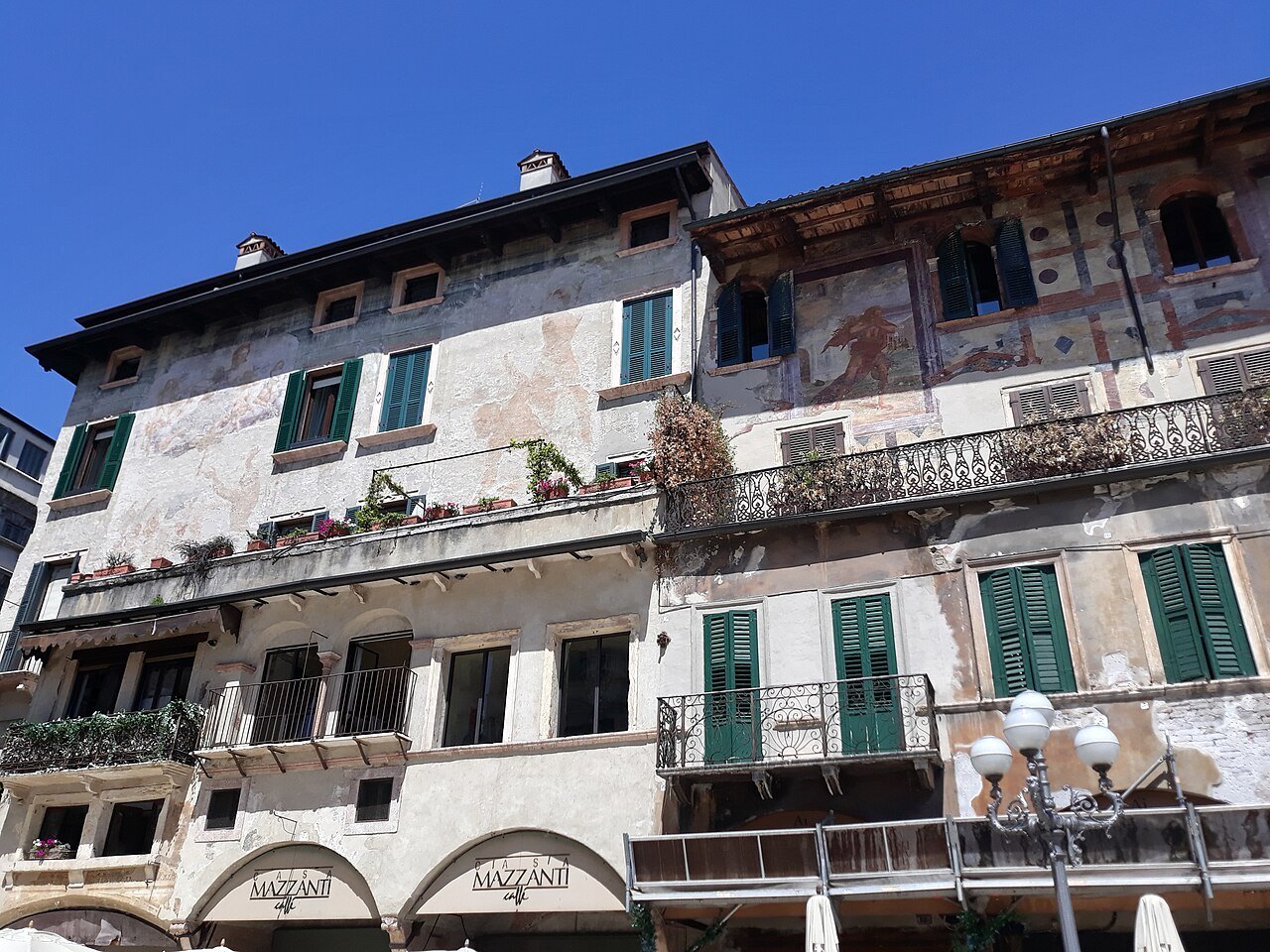The frescoed fronts of the Case Mazzanti above Piazza delle Erbe