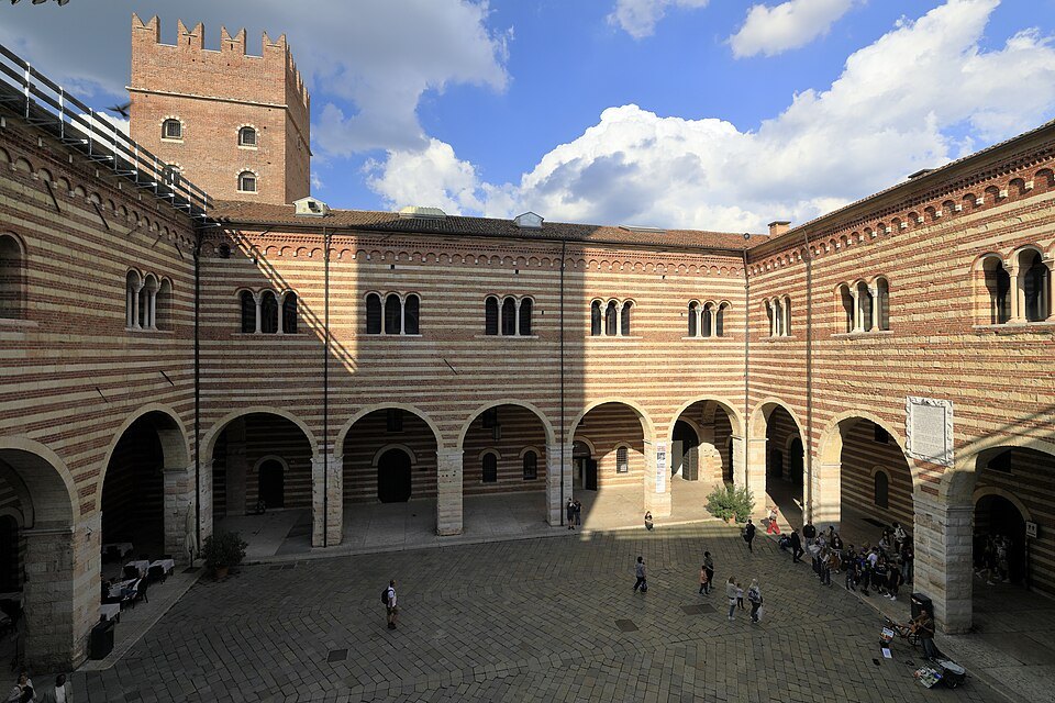 The striped brick courtyard of the Cortile Mercato Vecchio
