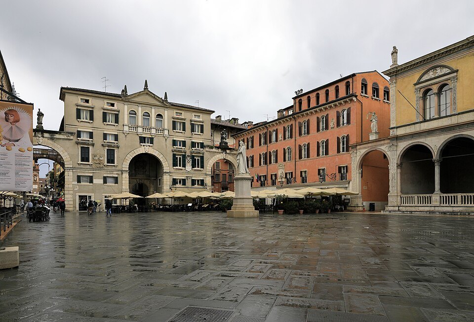 The square after rain, the Loggia del Consiglio and Dante's statue