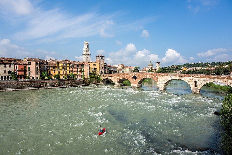 The Adige in spate beneath the bridge and the old town