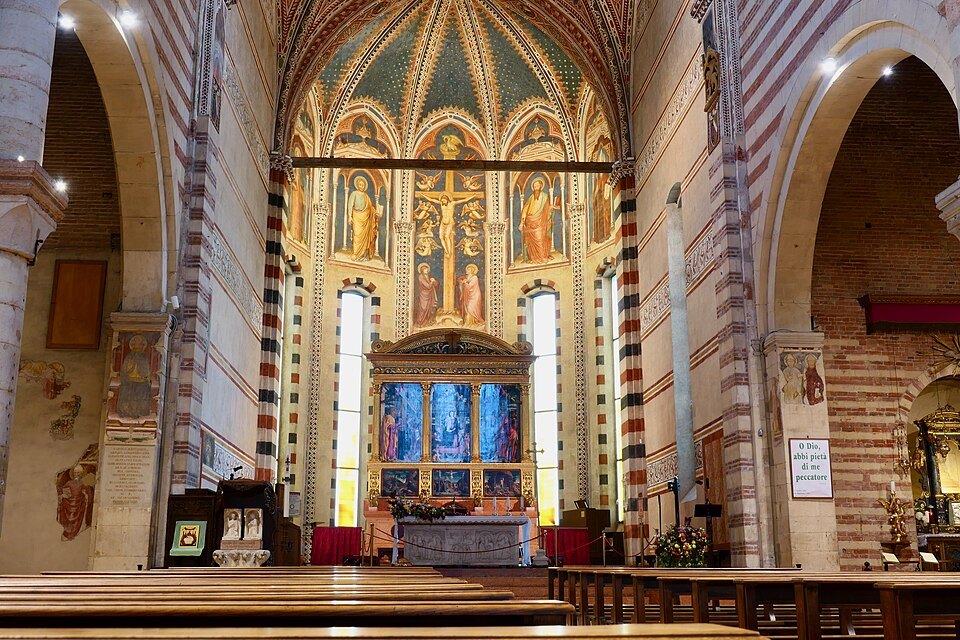 The raised choir and Mantegna's altarpiece at the end of the nave