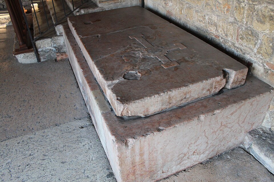 A stone tomb slab in the cloister