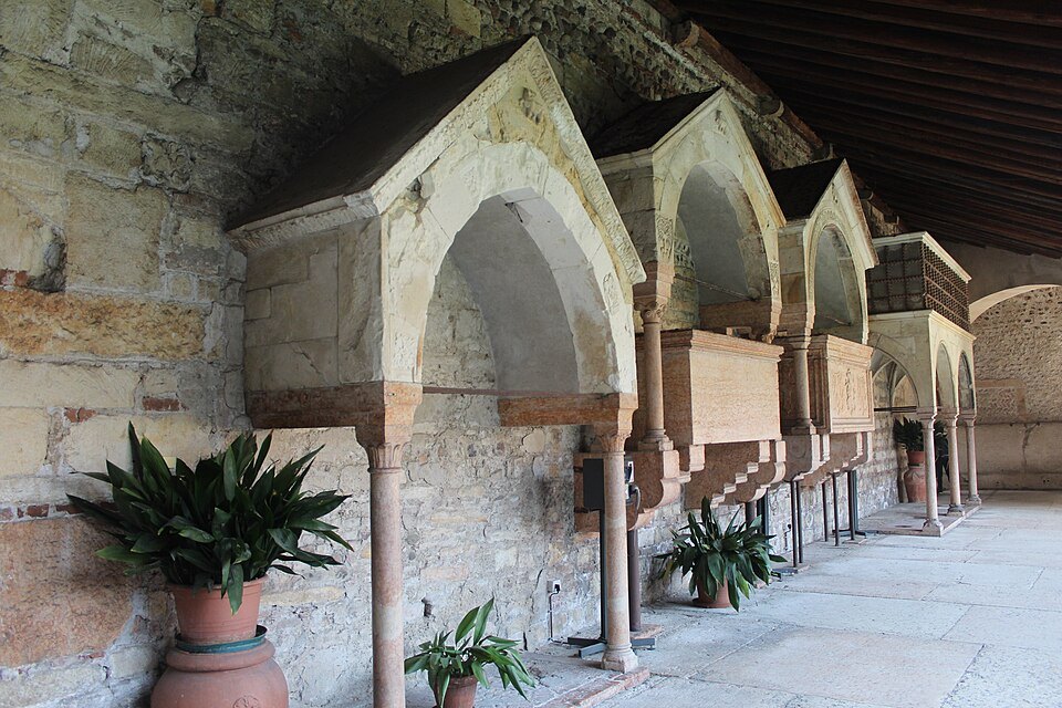 Tombs set under arches in the cloister of San Zeno