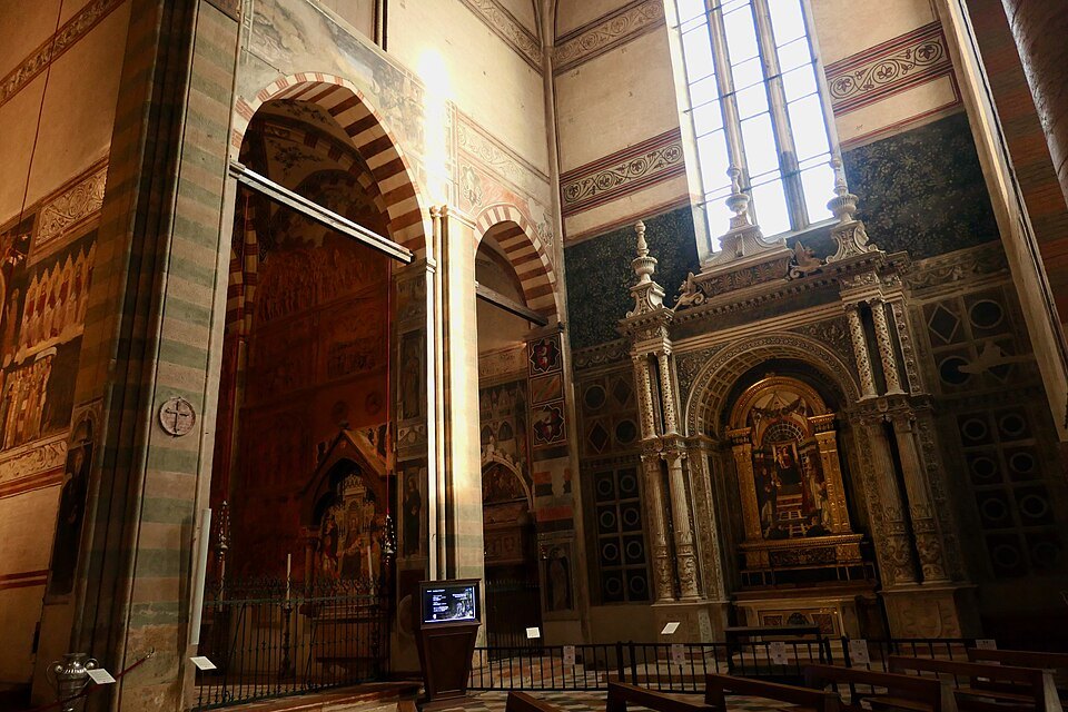 A side chapel's altarpiece in the dim interior