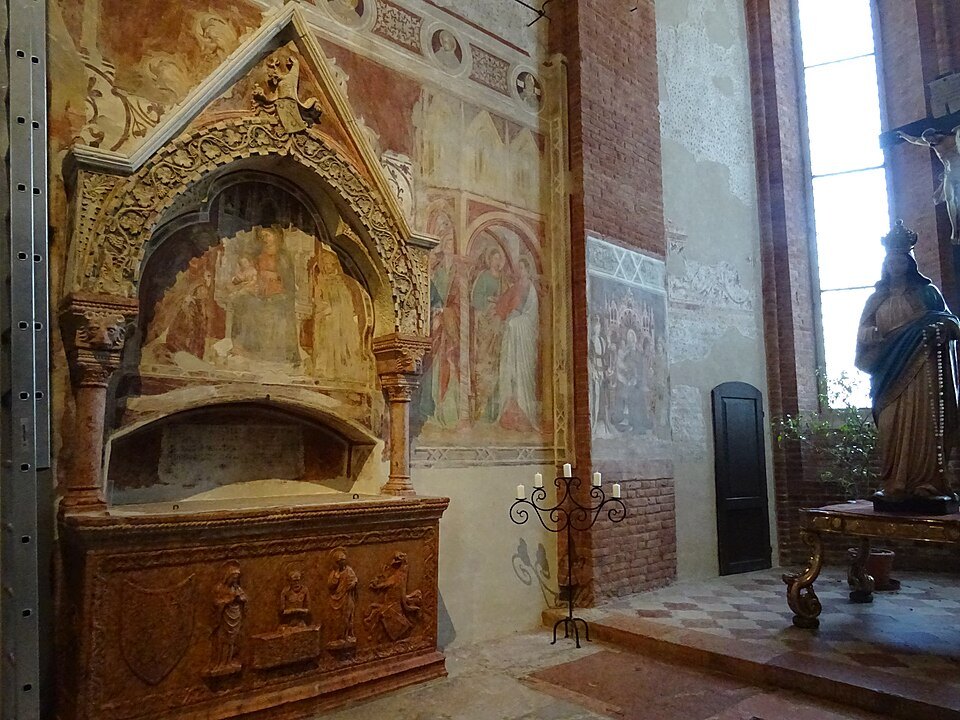 A frescoed tomb niche inside the church