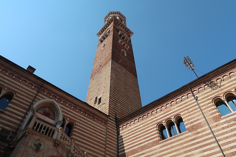 The Palazzo della Ragione's striped walls at the tower's foot
