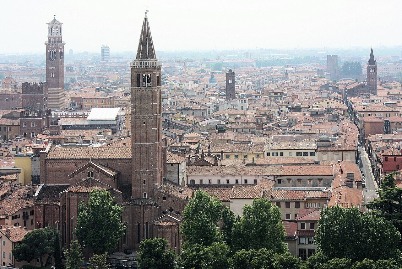 The Torre dei Lamberti among the old city's roofs, seen from across the river