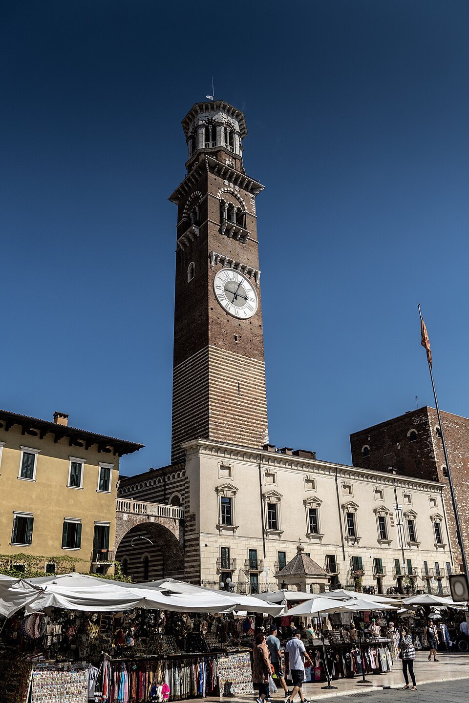 The tower and its clock above the market stalls of Piazza delle Erbe